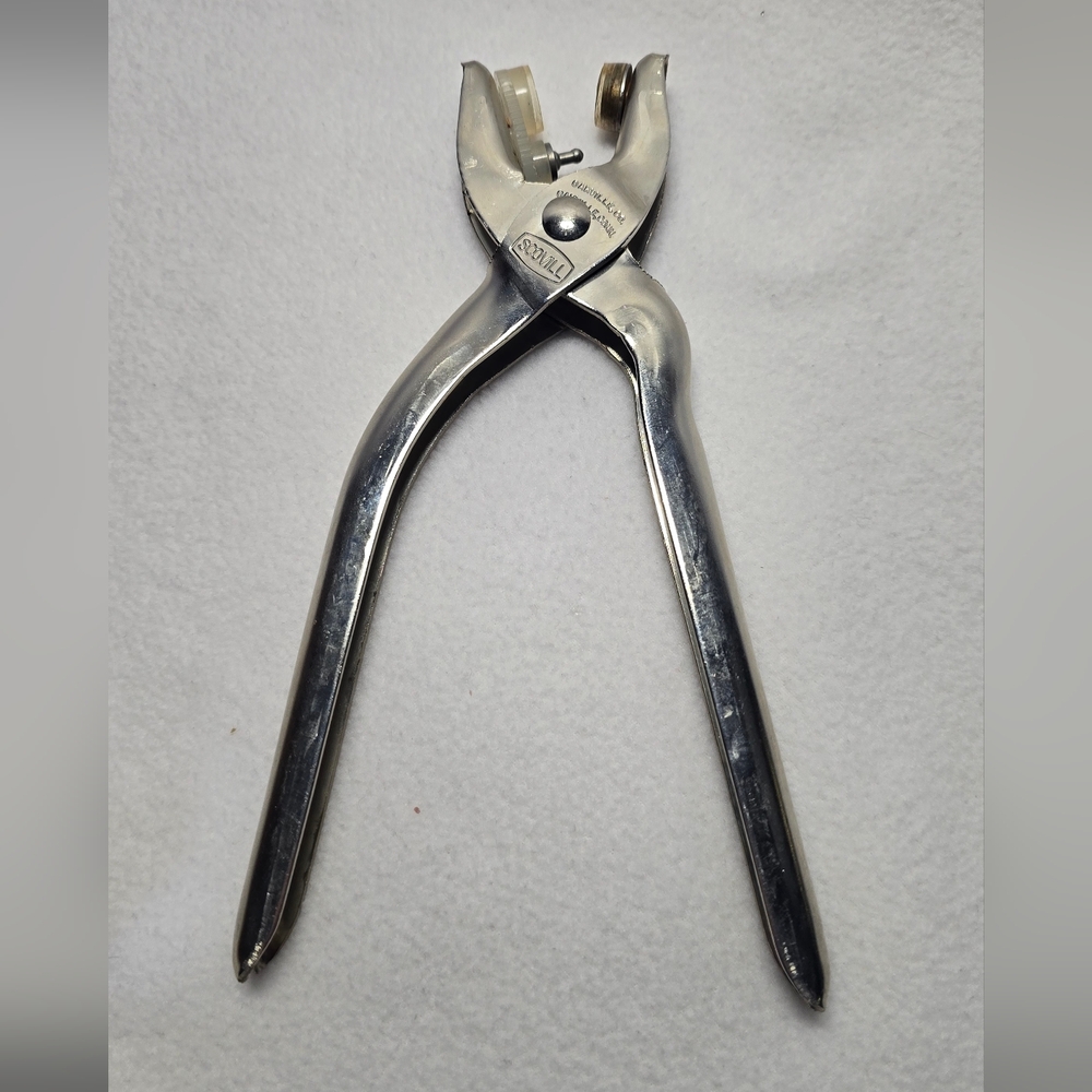 vintage Scovill "Clinton" gripper plier is a tool used for setting grommets